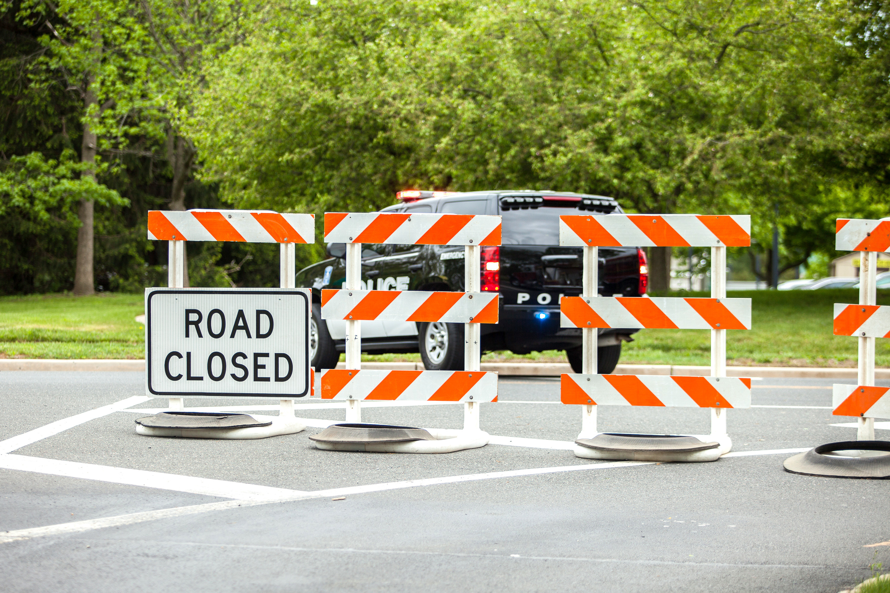 Closed road with police car